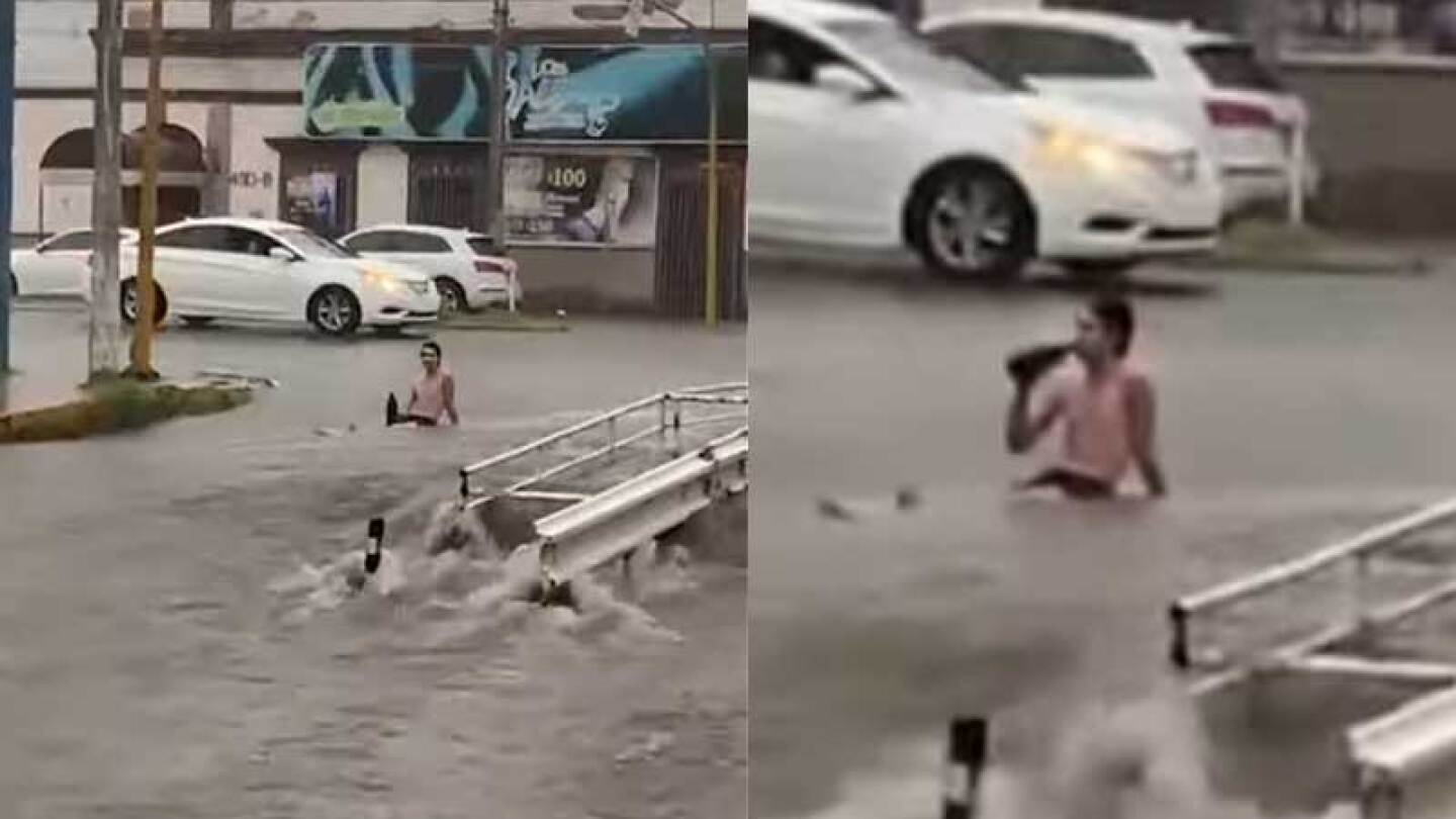 Hombre goza de la lluvia a pana calle